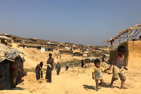 Rohingya refugee boys walk at Kutupalang Unregistered Refugee Camp in Cox's Bazar, Bangladesh, February 27, 2017. REUTERS/Stringer