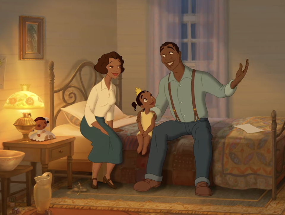 Tiana sits on a bed between her parents, Eudora and James, in a cozy bedroom. James gestures animatedly as Eudora smiles