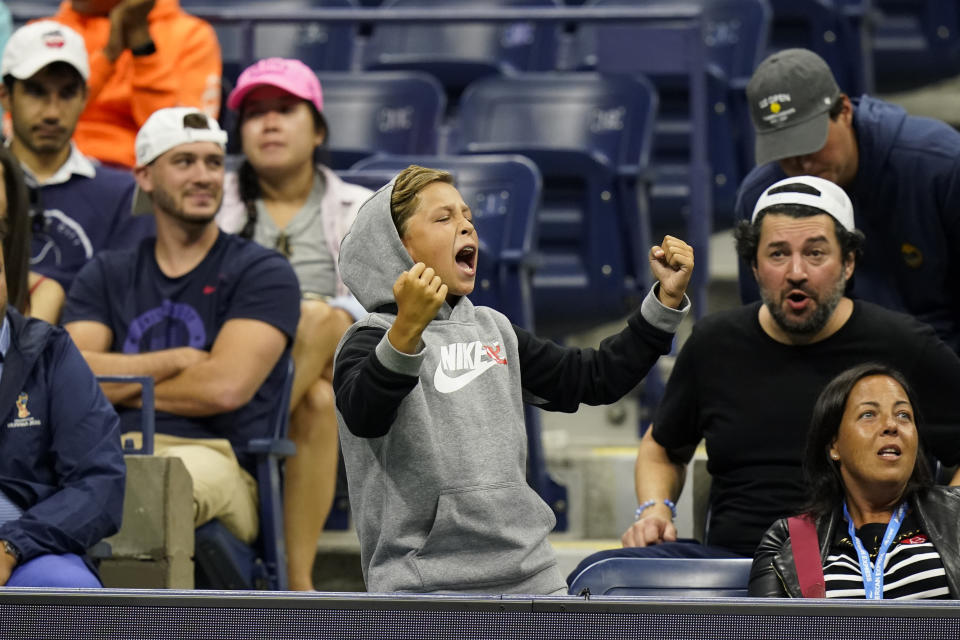 A fan cheers for Andrey Rublev, of Russia, as he plays Frances Tiafoe, of the United States, during the third round of the US Open tennis championships, Saturday, Sept. 4, 2021, in New York. (AP Photo/Frank Franklin II)