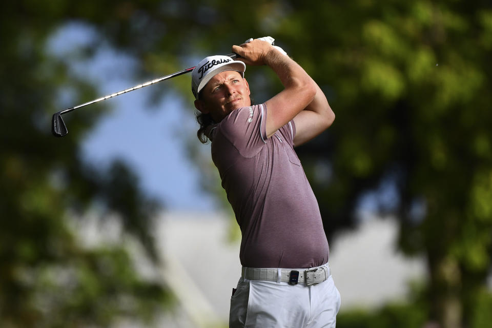 Australia's Cameron Smith plays a shot late on the final round on his way to winning the Australian PGA Championship at the Royal Queensland Golf Club in Brisbane, Sunday, Nov. 27, 2022. The world No.3 Smith shot a three-under 68 to finish 14-under par, three strokes clear. (Jono Searle/AAP Image via AP)