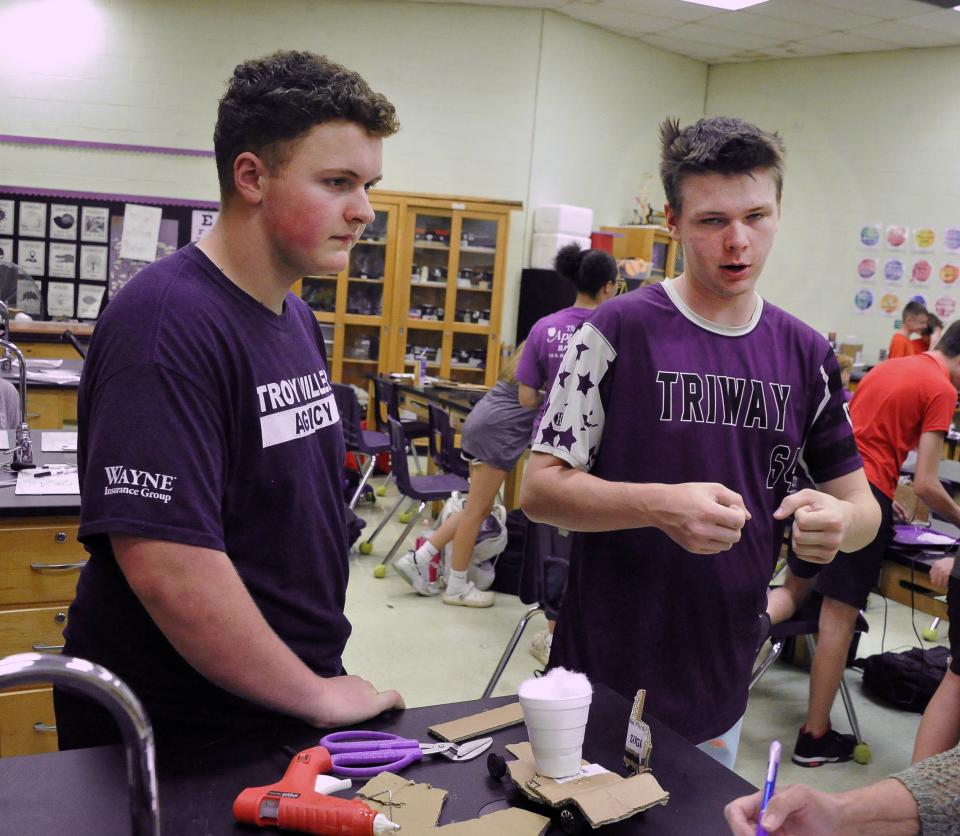 Balin Finley and Taran Tate explain how they designed their car. "We wanted it to look like an F1," Tate said, describing their egg mobile's spongy front bumper engineered to protect the egg.