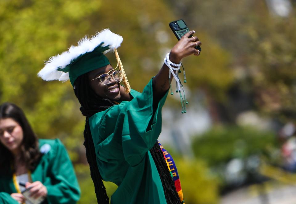 Class of 2023 member Kadijatou Jammeh takes a selfie prior to the Michigan State University 2023 Spring Commencement at the Breslin Center in East Lansing, Friday, May 5, 2023.
