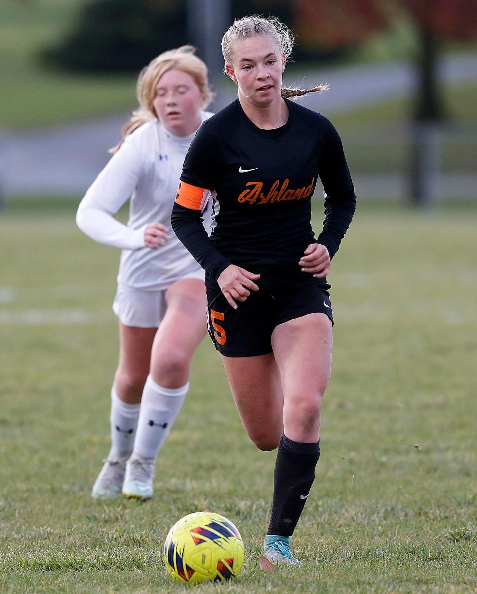 Ashland High School's Caley Biddinger (5) works the ball down field past Springfield High School's Emily Cox (16) during high school girls soccer action at Ashland Community Soccer Stadium Wednesday, Oct. 19, 2022. TOM E. PUSKAR/ASHLAND TIMES-GAZETTE