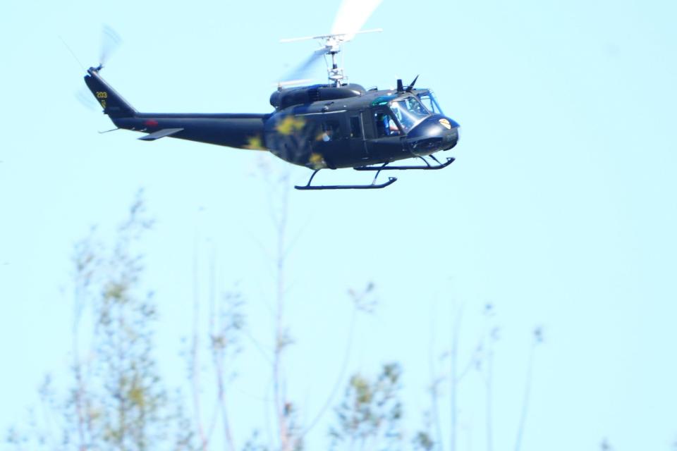 A flyover featuring a Vietnam War-era 'Huey' helicopter participates in the 18th Annual Memorial Day Ceremony at the South Florida National Cemetery on Monday, May 27, 2024, near Lake Worth Beach.