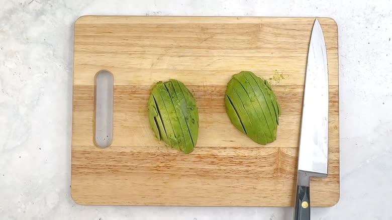 sliced avocado on chopping board