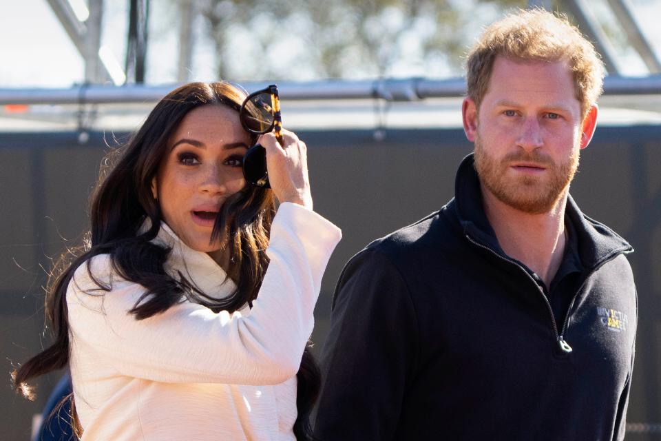 FILE - Prince Harry and Meghan Markle, Duke and Duchess of Sussex visit the track and field event at the Invictus Games in The Hague, Netherlands, Sunday, April 17, 2022. The production company founded by Prince Harry and his wife, Meghan, are splitting ways with Spotify, Friday, June 16, 2023, less than a year after the debut of their podcast “Archetypes.