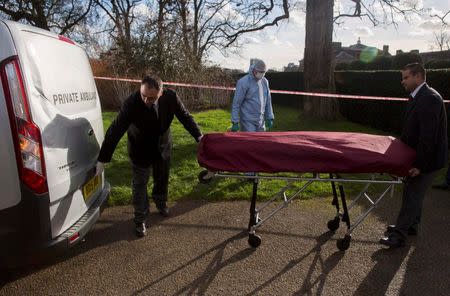 Undertakers remove a body from near the grounds of Kensington Palace in London, Britain February 9 2016. REUTERS/Neil Hall