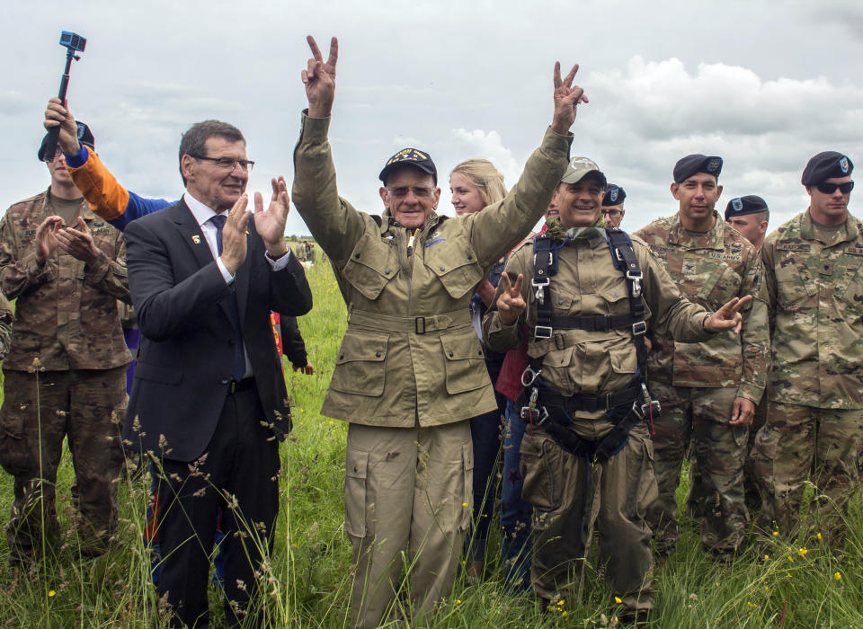 U.S. World War II D-Day veteran Tom Rice, from Coronado, CA, after parachuting in a tandem jump into a field in Carentan, Normandy, France, Wednesday, June 5, 2019. Approximately 200 parachutists participated in the jump over Normandy on Wednesday, replicating a jump made by U.S. soldiers on June 6, 1944 as a prelude to the seaborne invasions on D-Day. (AP Photo/Rafael Yaghobzadeh)