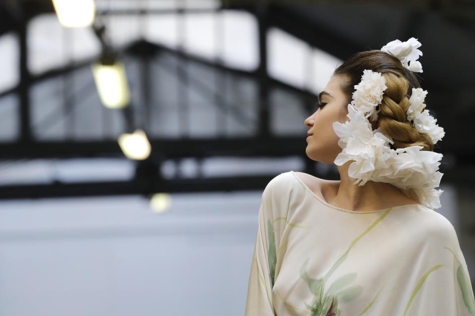 A model wears a creation for the Franck Sorbier Haute Couture Spring/Summer 2020 fashion collection presented Tuesday Jan. 21, 2020 in Paris. (AP Photo/Christophe Ena)