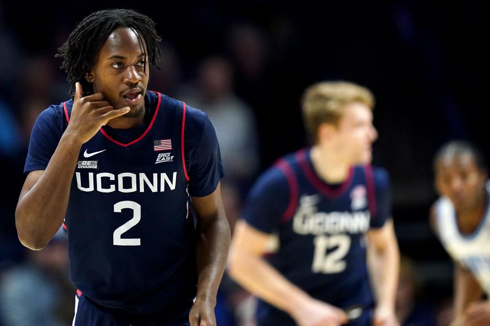 Connecticut Huskies guard Tristen Newton (2) reacts after making a 3-point basket in the first half of a college basketball game between the Connecticut Huskies and the Xavier Musketeers, Wednesday, Jan. 10, 2024, at Cintas Cetner in Cincinnati.