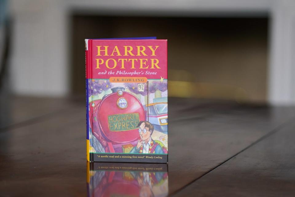 A first edition of Harry Potter and The Philosopher’s Stone, with illustration by Thomas Taylor (PA)