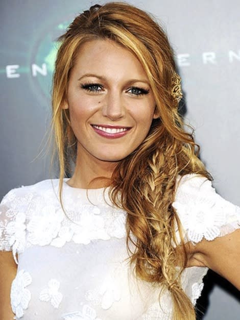 Blake Lively, known for her perfectly tousled / messy hair adds a few fishtail braids to her hair for a bohemian summer look