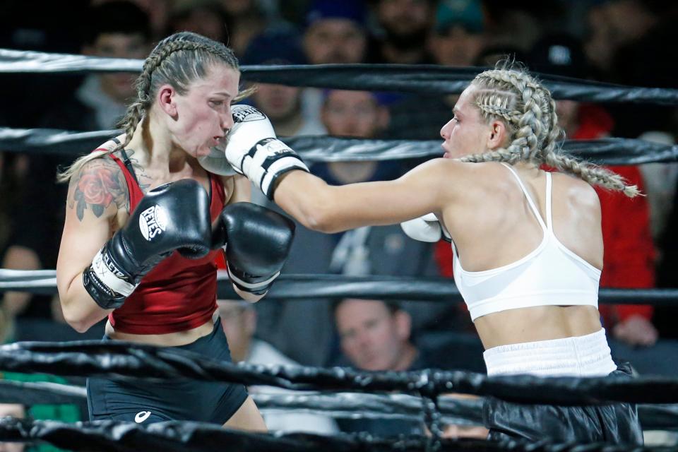 North Providence native Vicky D'Errico lands a punch during her bout against Heather McDonald in their fight at Barstool Sports' Rough N Rowdy on Friday night. D'Errico came away with the victory in her second appearance at a Rough N Rowdy event in Providence.