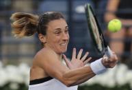 Croatia's Petra Martic returns the ball to Kazakhstan's Elena Rybakina during a semi final match of the Dubai Duty Free Tennis Championship in Dubai, United Arab Emirates, Friday, Feb. 21, 2020. (AP Photo/Kamran Jebreili)