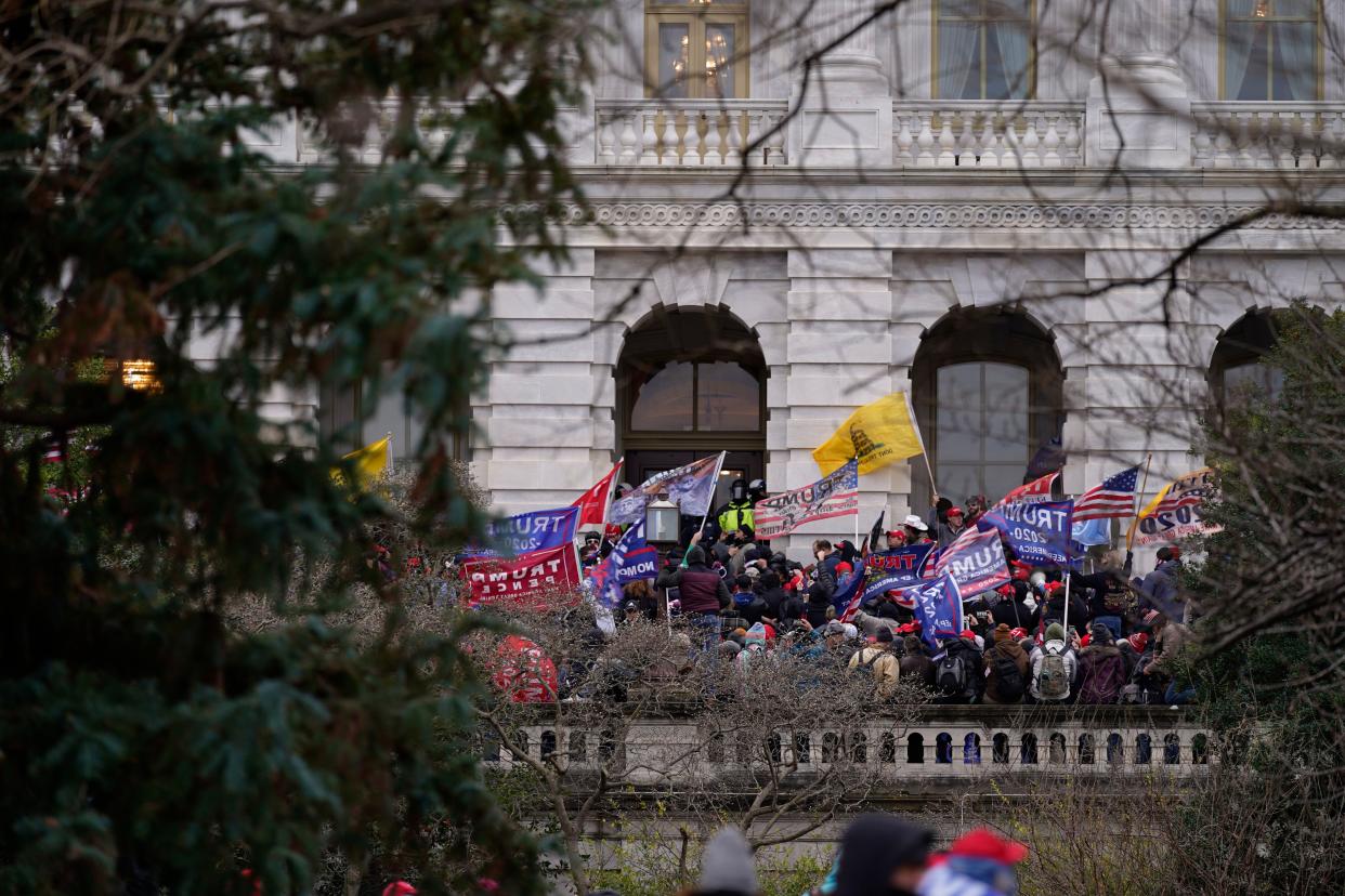 Trump supporters arrive at a Capitol side entrance, Wednesday, Jan. 6, 2021, in Washington. As Congress prepares to affirm President-elect Joe Biden's victory, thousands of people have gathered to show their support for President Donald Trump and his claims of election fraud.