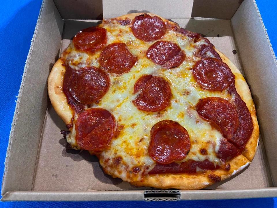 A personal pepperoni pizza from a LaRosa’s Pizzeria stand at Kroger Field.