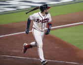 Atlanta Braves' Travis d'Arnaud flips his bat after hitting a home run during the fourth inning in Game 2 of a baseball National League Division Series against the Miami Marlins Wednesday, Oct. 2020, in Houston (Curtis Compton/Atlanta Journal-Constitution via AP)