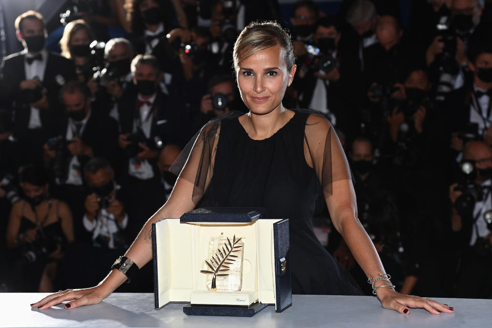 CANNES, FRANCE - JULY 17:  Julia Ducournau poses with the Palme d'Or 'Best Movie Award' for 'Titane' during the 74th annual Cannes Film Festival on July 17, 2021 in Cannes, France. (Photo by Pascal Le Segretain/Getty Images)