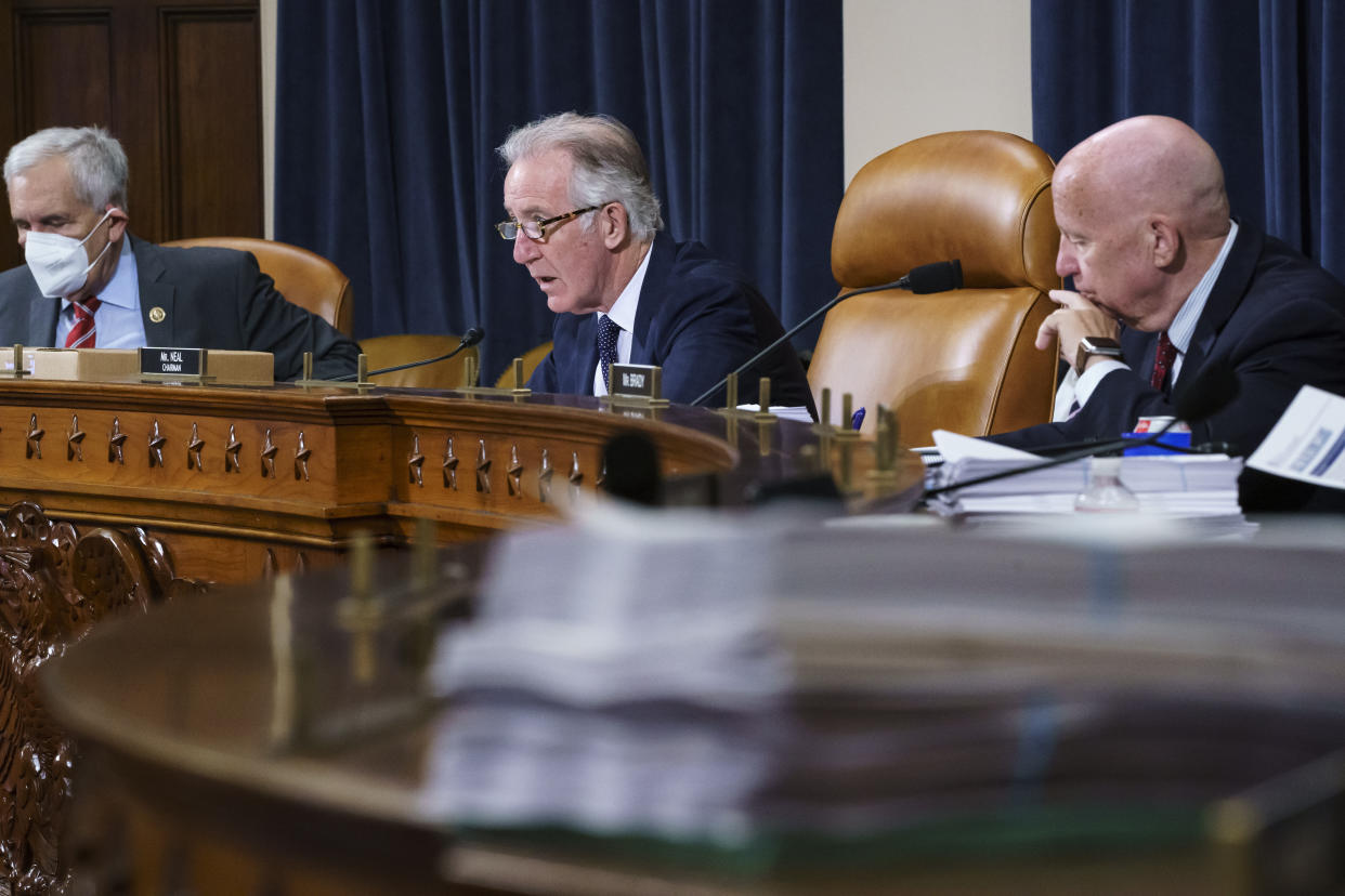 House Ways and Means Committee Chairman Richard Neal, D-Mass., center, flanked by Rep. Lloyd Doggett, D-Texas, left, and Rep. Kevin Brady, R-Texas, the ranking member, right, make opening statements as the tax-writing panel continues work on the Democrats' sweeping proposal for tax hikes on big corporations and the wealthy to fund President Joe Biden's $3.5 trillion domestic rebuilding plan, at the Capitol in Washington, Tuesday, Sept. 14, 2021. (AP Photo/J. Scott Applewhite)