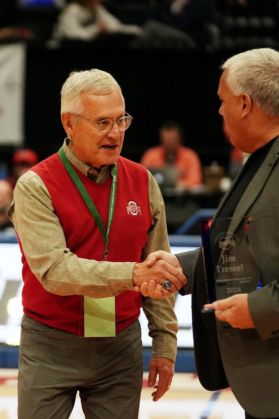 Mar 23, 2024; Dayton, Ohio, USA; The Ohio High School Athletic Association honors Jim Tressel as one of Ohio greats during the 2024 Boys State Basketball Tournament Saturday, March 23, as part of its Circle of Champions recognition program.