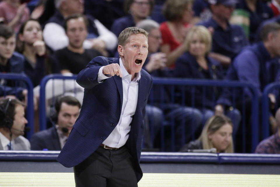 FILE - Gonzaga head coach Mark Few shouts to his players during the first half of an NCAA college basketball game against San Diego in Spokane, Wash., in this Thursday, Feb. 27, 2020, file photo. Gonzaga will begin the college basketball season No. 1 for the first time after coach Mark Few's bunch earned 28 first-place votes in the preseason AP Top 25 poll released Monday, Nov. 9, 2020.(AP Photo/Young Kwak, File)