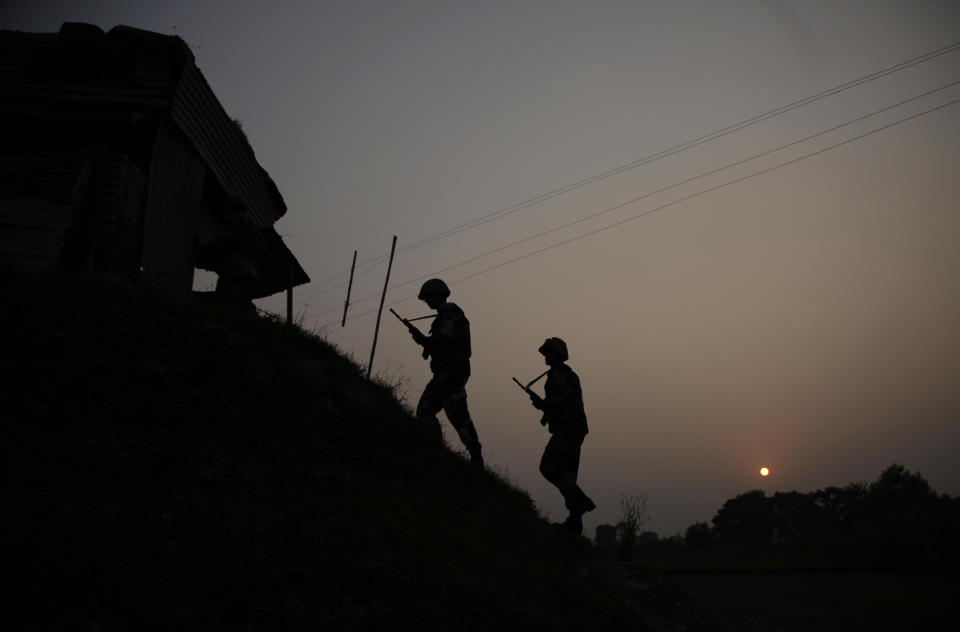 FILE - In this Oct. 1, 2016, file photo, Indian Border Security Force soldiers patrol near the India-Pakistan international border area at Gakhrial border post days after the country said it carried out "surgical strikes" against militants on the militarized frontier that divides the Kashmir region between India and Pakistan, in Akhnoor sector, about 48 kilometers from Jammu, India. In 2016, the government of Narendra Modi ordered a “surgical strike” inside the Pakistan-held portion of Kashmir by special forces against militants to avenge killings of 19 Indian soldiers who died in an audacious militant attack on a military installation in the garrison town of Uri. (AP Photo/Channi Anand, File)