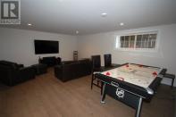 <p><span>296 Macmillan Point Road, West Covehead, P.E.I.</span><br> The spacious finished basement makes for an ideal games room.<br> (Photo: Zoocasa) </p>