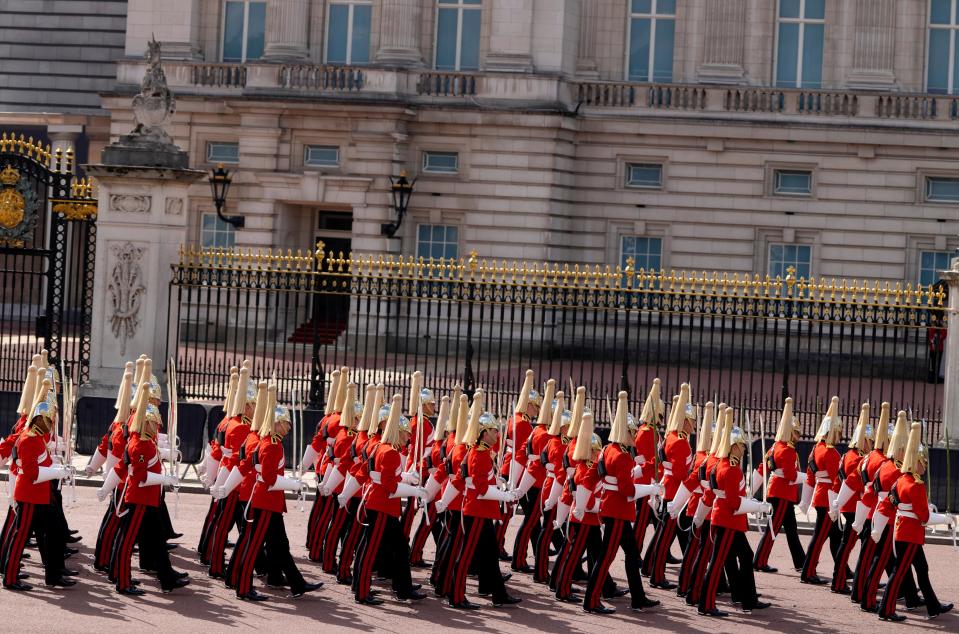 Members of the Household Cavalry march along the route prior to the procession which will carry the coffin of Queen Elizabeth II from Buckingham Palace to Westminster Hall (AP)