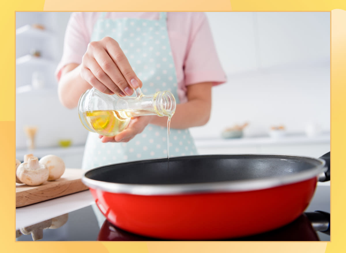 woman pouring a cooking oil into a pan