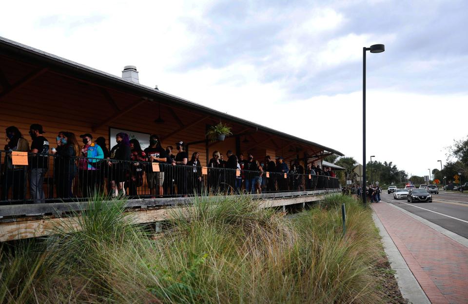 A line to claim passes for Fest 19 wraps around the Boxcar Beer and Wine Garden at Depot Park in Gainesville on Friday. The annual punk rock festival returned to town after a one-year hiatus due to the COVID-19 pandemic.