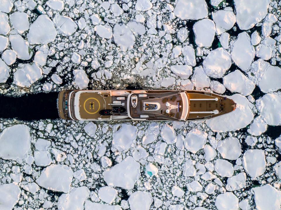 A ship sailing through blocks of ice