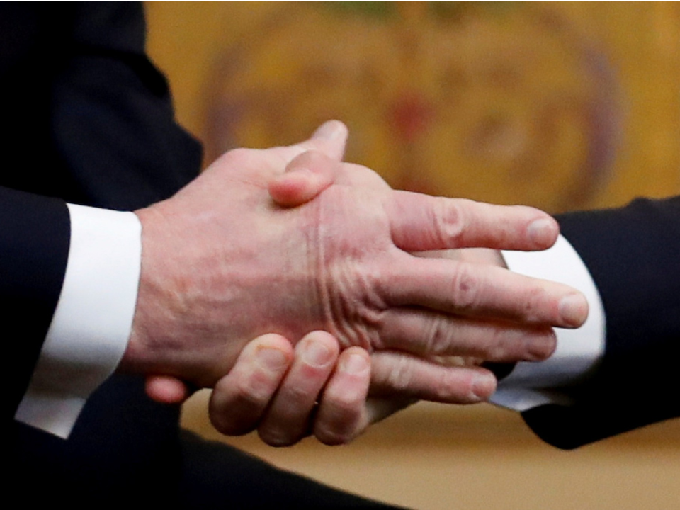 trump macron handshake