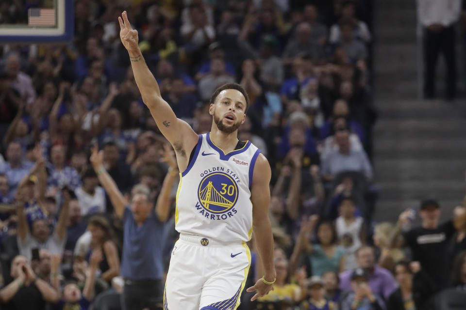 Golden State Warriors guard Stephen Curry gestures after making a 3-point basket against the Los Angeles Lakers during the first half of a preseason NBA basketball game in San Francisco, Saturday, Oct. 5, 2019. (AP Photo/Jeff Chiu)