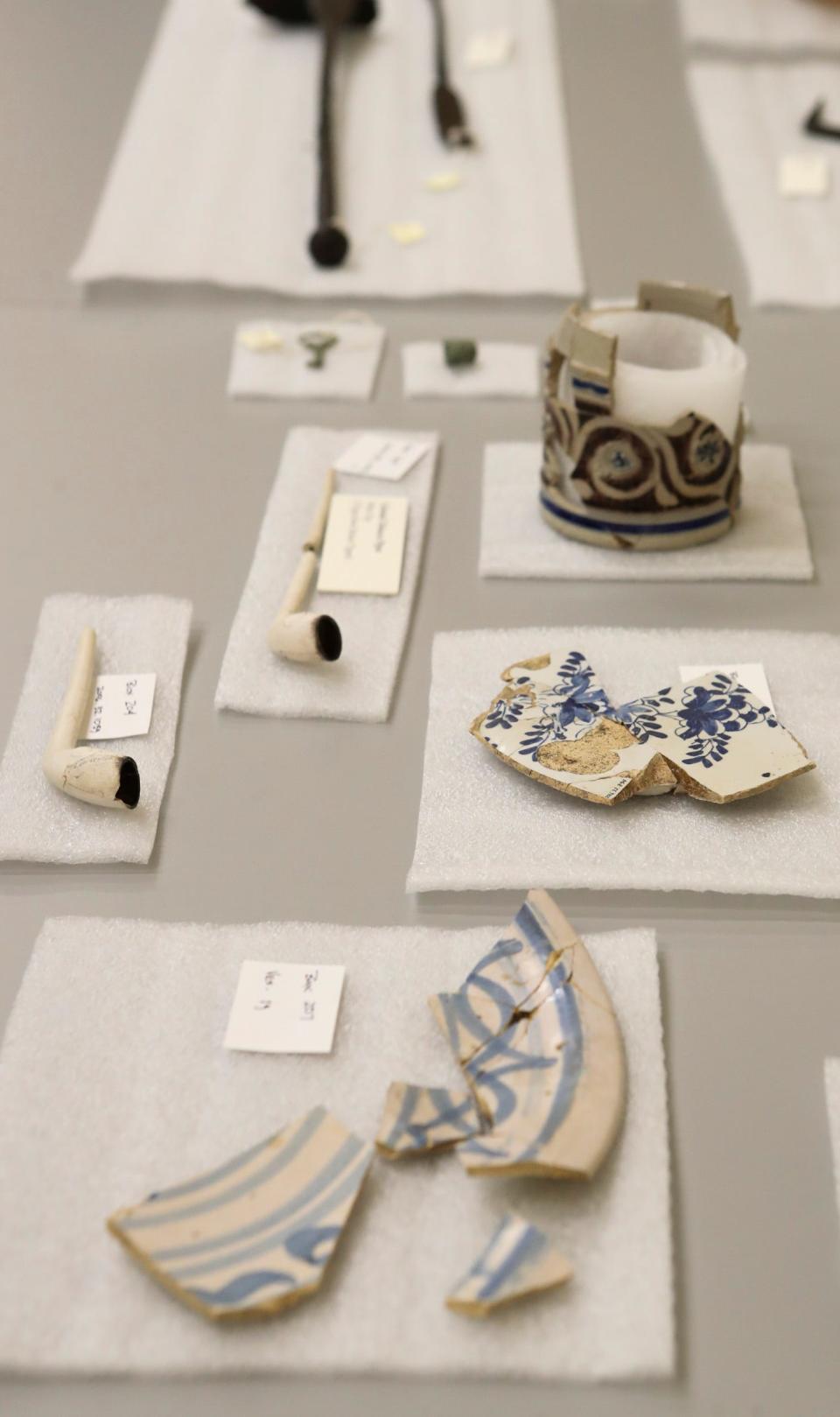 Objects, including pipes, ceramic vessels and plates and tools from the archaeological dig of Avery's Rest are displayed at the State of Delaware Center for Material Culture in Dover. Study of the site - which included multiple well-preserved graves- is acclaimed as providing a fuller picture of life in colonial Delaware and of its inhabitants.