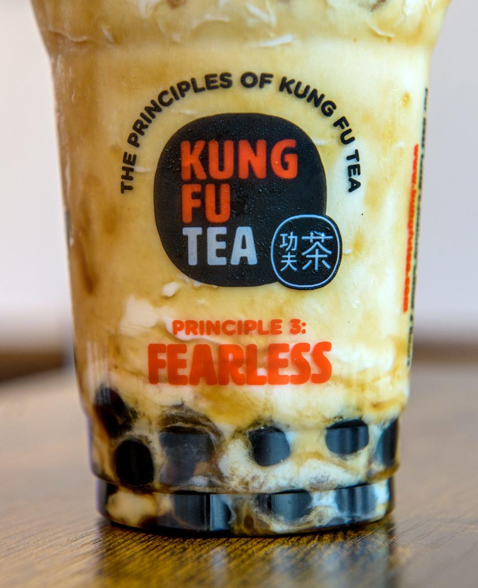 Bubbles sit at the bottom of a coconut milk tea at the new Kung Fu Tea shop in East Peoria's Levee District.