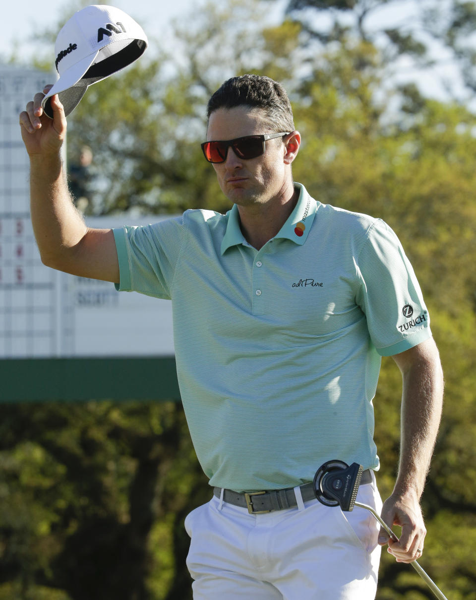 Justin Rose, of England, tips his hat on the 18th hole during the third round of the Masters golf tournament Saturday, April 8, 2017, in Augusta, Ga. (AP Photo/Charlie Riedel)