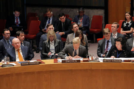 Britain's Ambassador to the United Nations, Karen Pierce, addresses the Russian Ambassador to the United Nations, Vasily Nebenzya about an incident in Salisbury, Britain, during a meeting of the U.N. Security Council at U.N. headquarters in New York, U.S., April 5, 2018. REUTERS/Lucas Jackson