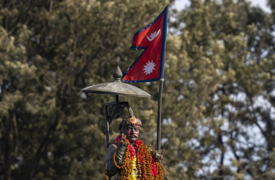 A statue of Nepal's late king Prithivi Narayan Shah is garlanded in Kathmandu, Nepal, Feb. 25, 2024. Nepal’s once unpopular monarchy — abolished after centuries of rule over the Himalayan nation — is hoping to regain some of its lost glory. Royalist groups and supporters of former King Gyanendra have been holding rallies to demand the restoration of the monarchy and the nation’s former status as a Hindu state. (AP Photo/Niranjan Shrestha)