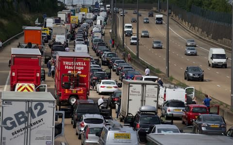 M25 Motorists are stranded on the M25 after ...Motorists are stranded on the M25 after a road accident closed a section of the motorway orbital in London on August 16, 2013. Eight people were reported to be injured and motorists warned of delays following a "serious collision" on the M25 involving "up to seven vehicles". AFP PHOTO / ANDREW COWIEANDREW COWIE/AFP/Getty Images - Credit: ANDREW COWIE /AFP