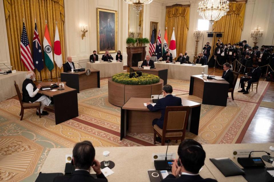 US President Joe Biden (2L), Indian Prime Minister Narendra Modi (L), Japanese Prime Minister Suga Yoshihide (C) and Australian Prime Minister Scott Morrison (Top C) sit down for the the first-ever in-person Quad Leaders Summit at the White House in Washington, DC on September 24, 2021.<span class="copyright">JIM WATSON/AFP via Getty Images</span>