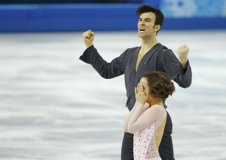 Meagan Duhamel and Eric Radford of Canada celebrate at the end of their performance during the Team Pairs Short Program at the Sochi 2014 Winter Olympics