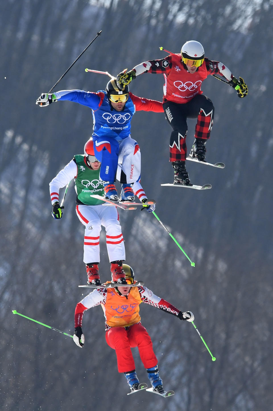 <p>Kevin Drury of Canada, Arnaud Bovolenta of France, Semem Denishchikov of Olympic athletes of Russia and Robert Winkler of Austria compete in the Freestyle Skiing Men’s Ski Cross Quarterfinals on day 12 of the PyeongChang 2018 Winter Olympic Games at Phoenix Snow Park on February 21, 2018 in Pyeongchang-gun, South Korea. (Photo by Quinn Rooney/Getty Images) </p>