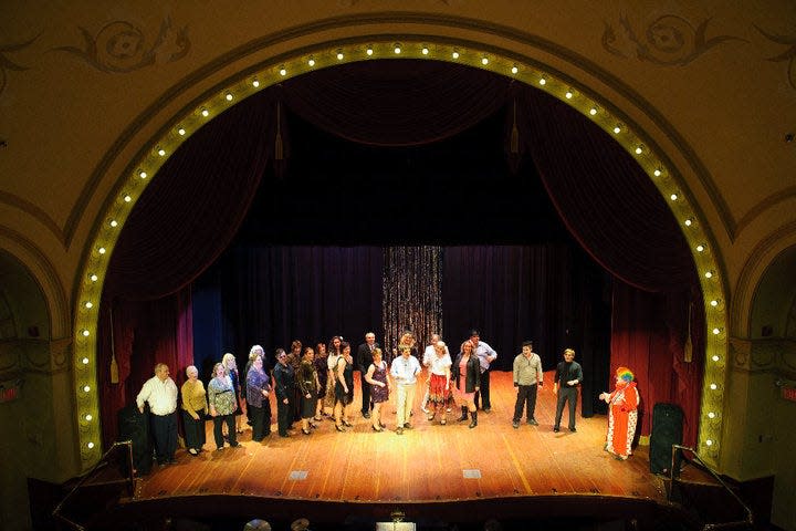Andrew Kurtz on the Cheboygan Opera House stage, second from right, in black, appearing in the 2010 Rivertown Follies.