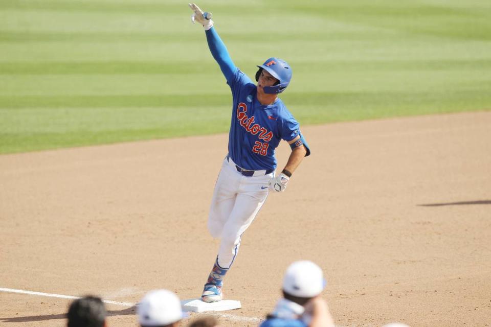 Florida’s Luke Heyman points to Gator fans as he rounds third after destroying a Clemson pitch for a homerun during NCAA Super Regionals action on Saturday, June 8, 2024 in Clemson, S.C.