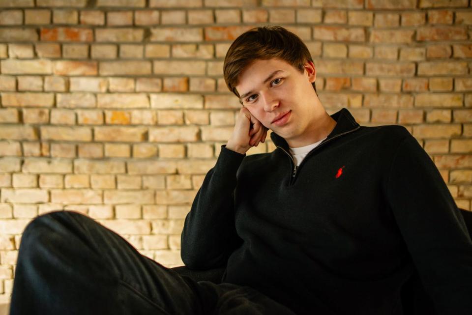 Ukrainian influencer Ihor Lachenkov poses for a portrait after an interview with The Kyiv Independent in Sens bookstore on March 29, 2024, in Kyiv, Ukraine. (Oleh Tymoshenko / The Kyiv Independent)