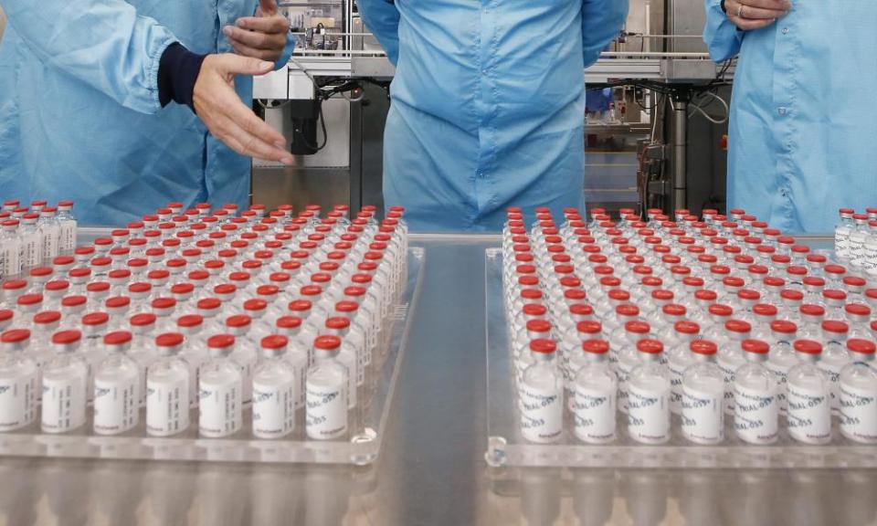 Prime Minister Scott Morrison is shown trial vials of the AstraZeneca vaccine during a visit to the CSL serum lab