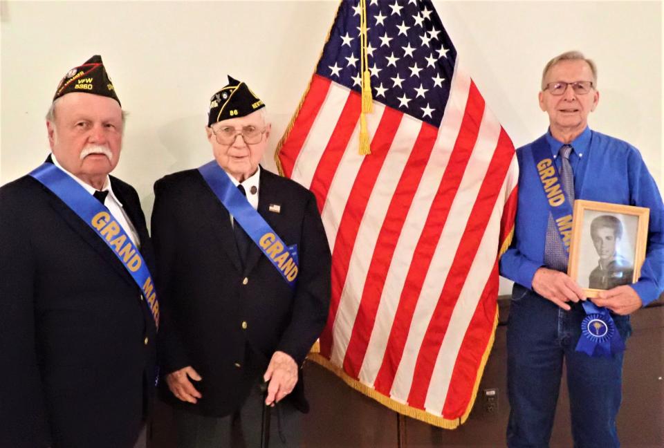 Grand Marshals for the annual Newton Memorial Day parade include, from left,  Edward "Charlie" Kampka, left,  representing the Vietnam War where he was an Army artilleryman, and Raymond Doyle, who served as a Navy engine mechanic, during Korea. At right, is Roger Faber, holding a picture of his father, Cornelius "Neal" Faber, when he was a sailor in World War II. The elder Faber will be leading the parade with Kampka and Doyle on Spring Street, beginning at 10 a.m. Monday. The parade will end with a service in Memory Park.