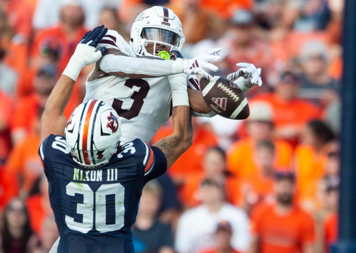 Auburn Tigers linebacker Larry Nixon III (30) breaks up a pass intended for Mississippi State Bulldogs wide receiver Justin Robinson (3) as Auburn Tigers take on Mississippi State Bulldogs at Jordan-Hare Stadium in Auburn, Ala., on Saturday, Oct. 28, 2023.