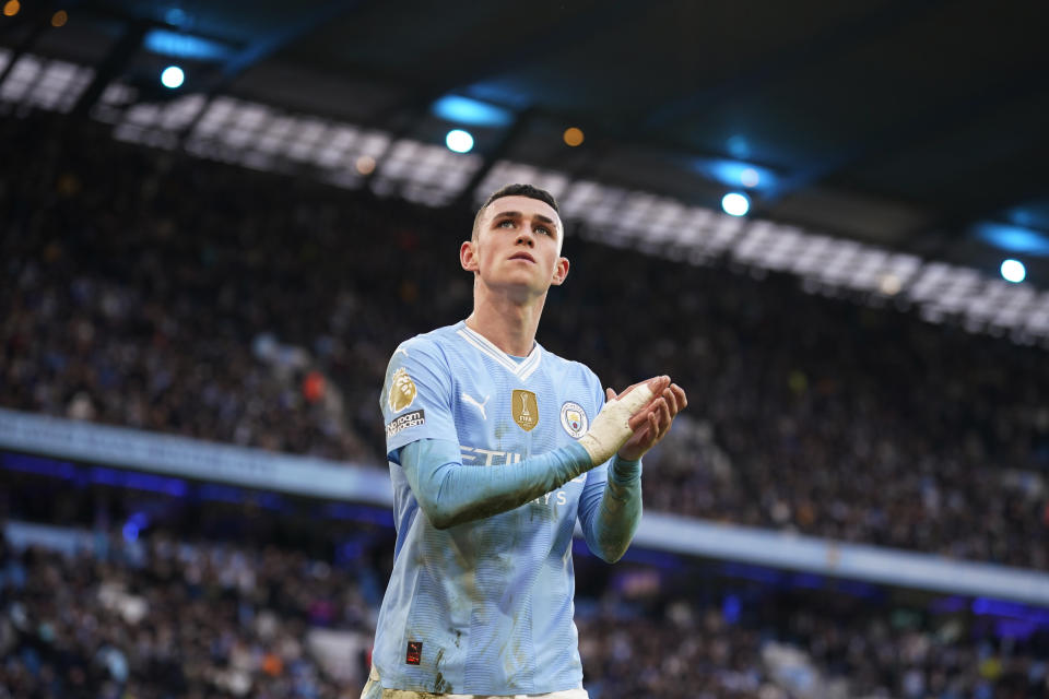 Manchester City's Phil Foden applauds supporters at the end of an English Premier League soccer match between Manchester City and Manchester United at the Etihad Stadium in Manchester, England, Sunday, March 3, 2024. (AP Photo/Dave Thompson)