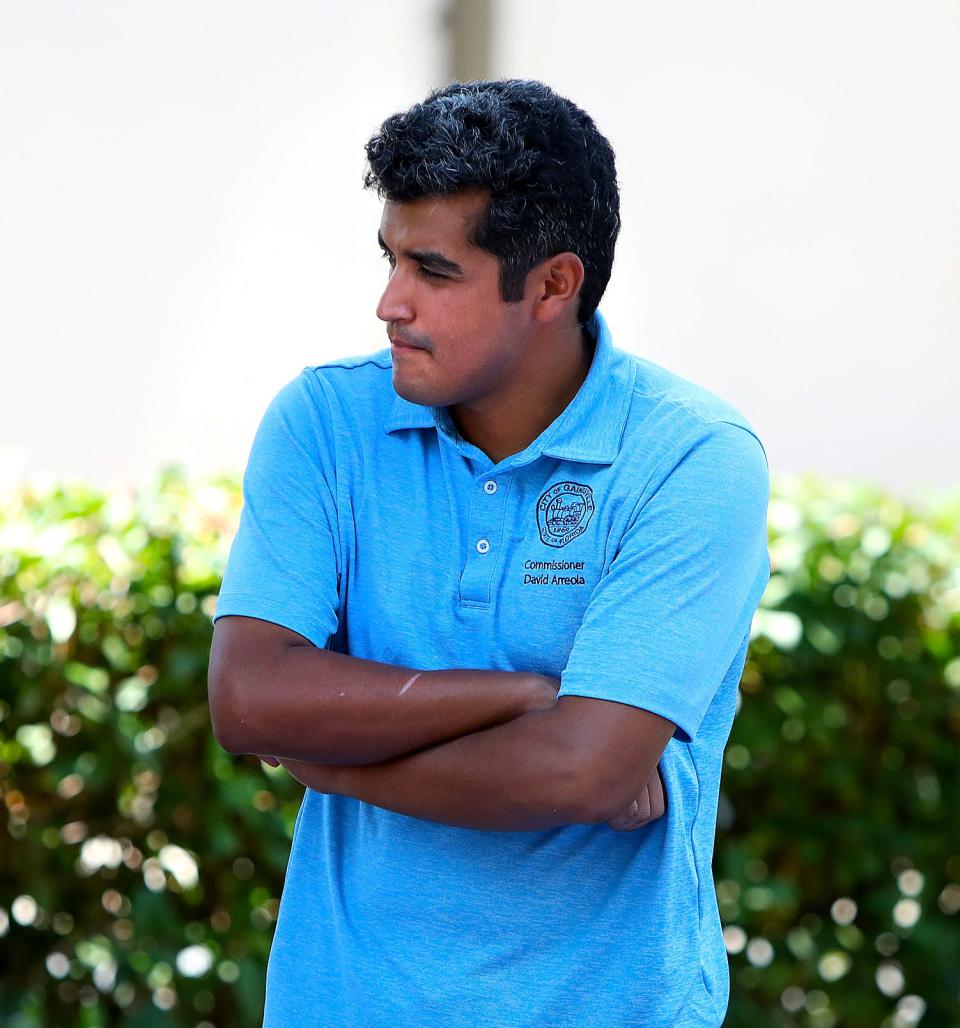 David Arreola, a candidate for Gainesville mayor, listens to a citizen during the Souls to the Polls event in Gainesville on Aug. 14. Arreola failed to make the run-off.